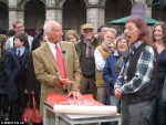 Moragh Turnbull and Paul Atterbury with posters at Antiques Roadshow